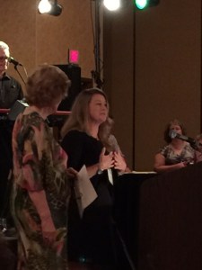 Laura Oles accepts Silver Falchion Award from Anne Perry. Photograph by Manning Wolfe.